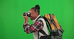 Photography, green screen or black woman tourist walking in studio with mockup space taking pictures. Traveling memory, lifestyle or African girl photographer hiking with a camera for an adventure 