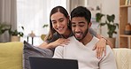 Video call, laptop and hello by happy couple on sofa, smile and excited while relaxing in their home together. Online, conversation and man with woman in a living room, cheerful and greeting on couch