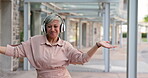 Senior woman with headphones, dancing in city and listening to music with freedom outdoor and travel. Professional female in urban street, carefree and happy with audio streaming playlist and energy