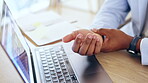 Laptop, hands and arthritis with a business person closeup, working alone in the office from above. Computer, wrist and carpal tunnel with a professional or corporate employee suffering an injury