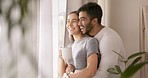 Relax, morning and couple hug with coffee in apartment for bonding, quality time and loving embrace. Interracial relationship, love and man and woman by window in conversation, talking and relax