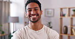 Happy, laughing and face of an Asian man in a living room, looking confidence and handsome. Smile, relax and portrait of a calm guy standing in the lounge of a home for happiness and stress relief