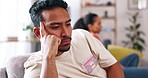 Angry, fight and couple on a sofa arguing about divorce, cheating or breakup in their home together. Marriage, crisis and man with woman on a couch after confrontation, divorce or addiction argument 