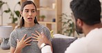 Couple, divorce and fight in conflict or argument on sofa in living room dispute or unhappy relationship at home. Frustrated or upset woman and man talking in disagreement, breakup or cheating affair