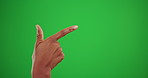 Mockup, pointing and hand of person on green screen for product placement, news and information. Space, offer and promotion with gesture on studio background for message, notification and opinion 