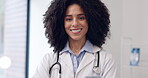 Woman, face closeup and a doctor at a hospital for healthcare, consulting and surgery. Smile, medical and portrait of a female gp with confidence, happiness and smiling at a clinic for work