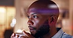 Black man, night coffee and business employee in a office late thinking with ideas. Businessman, working and corporate work of a African worker reading computer data for planning on company tech