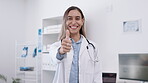 Happy, doctor face and woman with a thumbs up for healthcare, medical consulting and success. Smile, thank you and portrait of a female gp showing a hand gesture for hospital work and insurance