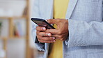 Closeup, man and hands with smartphone in office for online user, contact and reading professional chat. Employee typing on cellphone for networking, mobile app or scroll to social media notification