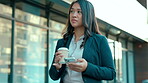 Coffee, phone and business woman walking and texting in the morning searching social media outside office buildings. City, tea and employee or worker commuting or walk to work and search online