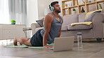 Yoga, calm and a man doing meditation from a laptop for relaxation, exercise and mindfulness. Morning, fitness and a guy stretching while listening to calming music and following a tutorial on a pc