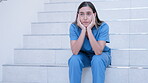 Fail, sad and woman nurse or doctor disappointed sitting on stairs depressed or frustrated in hospital or clinic. Medical, difficult and female healthcare professional on steps with anxiety or stress