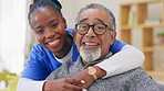 Senior man, nurse and hug with face, smile and care in house for retirement, wellness and happiness. Nursing home, black woman and elderly male with portrait, support and happy for healthcare service