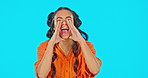 Face, mockup and woman shouting, announcement and news with happiness against a blue studio background. Portrait, female and person with gesture for screaming, loud and communication with excitement