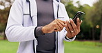 Hands, man and phone outdoor typing for communication with network connection for a chat in nature. Male model person with a smartphone in hand for social media, research on mobile app at park