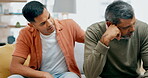 Depression, trust or empathy with a father and son talking in the living room to comfort, console or care. Family, love and support with young man helping a senior parent through pain, grief or loss