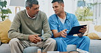 Tablet, assisted living and a nurse talking to a resident about his prescription medication in a living room. Insurance, healthcare and a male medicine professional explaining treatment to a patient