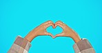 Love, like and heart hands of woman on studio backdrop with mockup and freedom and support. Happy hand gesture for kindness, likes and care for global solidarity and respect isolated blue background.