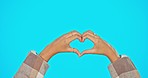 Mock up, like and heart hands of woman on studio backdrop with mockup and freedom and support. Happy hand gesture for love, likes and care for global solidarity and respect isolated blue background.