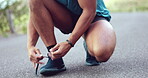 Lace shoes, person and hands for running workout, training and performance on road outdoors. Closeup of athlete, runner and tie sneakers on feet, footwear and exercise for sports, fitness and cardio