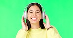 Face, green screen and woman with headphones, dance and music streaming against a studio background. Portrait, female and person with headset, listening to audio and sounds for movement and smile