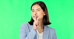 Green screen, secret and wink face of happy woman, privacy and finger on lips in studio. Portrait of female model, silence and smile for business surprise announcement, whisper emoji and mystery deal