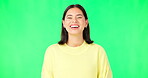 Green screen, laughing woman and face with smile, happiness and humor on color background. Portrait of happy female model in good mood, cheerful personality and funny joke in studio, comedy and meme