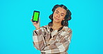 Phone, green screen and angry woman in studio with website, mobile app or network connection glitch. Portrait of frustrated gen z female model with smartphone 404, brand or logo product placement