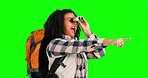 Green screen woman, hiking binocular and pointing at adventure scenery, sightseeing view or bird watching site. Backpacking wow, chroma key discovery and happy female trekking on studio background