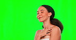 Beauty, skin and touching with a woman on a green screen background in studio for wellness. Luxury health, relax and skincare with an attractive young female rubbing her soft, smooth or silky body