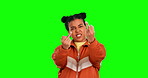 Fuck, hand gesture and an angry woman on a green screen background in studio being rude or obscene. Portrait, emoji and protest with a frustrated young female person looking unhappy on chromakey