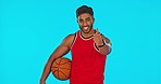 Basketball, man and thumbs up for success in sports isolated in studio on blue background mockup. Face portrait, happy athlete or spin ball with emoji for exercise goals, like or hand gesture for yes