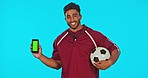 Soccer man, green screen phone and studio with smile, sports mockup and happiness for fitness. Football coach, smartphone and blank chromakey mockup with ball, excited face and portrait by backdrop