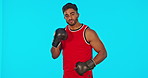 Face, boxer challenge and man in studio isolated on a blue background mockup. Portrait, boxing athlete and Indian person punching for fitness, exercise and training for fight, competition and sports.