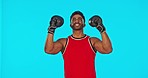 Face, boxer and man challenge in studio isolated on a blue background mockup. Portrait, boxing athlete and Indian person celebrate for winning, exercise and training for fight, competition and sports