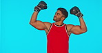 Boxer, man and winner in sports studio isolated on a blue background mockup. Athlete, boxing and face portrait of happy Indian person in celebration of success, achievement and champion winning.