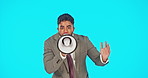 Business man, speaking and megaphone isolated on blue background broadcast, breaking news or announcement. Face of professional person with voice, sound and attention, opinion or speech in studio