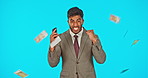 Money rain, winner man and phone isolated on studio background bonus, profit or online trading and lotto. Yes, fist pump and cash air in face of winning business person, lottery or financial freedom