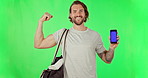 Fitness, flex and green screen with man and phone for mockup, muscle and website. Digital, technology and pointing with male athlete on studio background for sports app, internet and social media