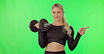 Workout, dumbbell and woman on green screen and pointing finger at space or gym mockup. Portrait of athlete person exercise or fitness for strong muscle or wellness offer, promotion or discount
