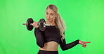 Pointing, exercise and woman with dumbbell on green screen advertising space or gym mockup. Portrait of athlete person and fitness workout with hand gesture for wellness offer, promotion or discount 