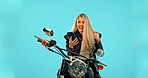 Motorbike, phone and woman winning isolated on blue background success, bonus or online competition. Motorcycle person or winner fist pump for news, travel promotion or lottery announcement in studio