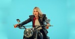 Motorbike, studio and woman with confidence on a ride adventure with wind in hair and confidence. Female model, isolated and blue background of a person thinking on motorcycle on a road trip journey