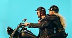 Travel, speed and couple on motorcycle for adventure, road trip and holiday mockup on blue background. Motorbike, transport and man and woman ride together for weekend, vacation and trip in studio