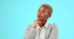 Thinking, happy and black woman in studio with idea, decision and contemplation on blue background. Deciding, choice and female employee smile with positive mindset, ambition and empowering idea