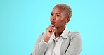 Confused, thinking and black woman in studio with decision, choice and pensive on blue background. Doubt, worry and lady employee with questions, deciding or contemplating emoji while posing isolated