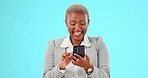 Phone, laugh and face of black woman on blue background chatting, smile and happy in studio. Communication, network and girl laughing on smartphone for funny website, meme and humor on mobile app