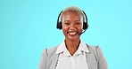 Black woman, callcenter and face, phone call and smile, CRM and contact us with mockup on blue background. Portrait, help desk and female consultant talking in studio, headset and customer service