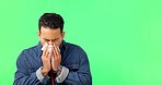 Man sneezing, blowing nose on green screen and sick with cold or flu, allergies and sinus problem with mockup space. Health, portrait and hayfever with tissue, male and virus on studio background
