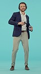 Business man, dancing and headphones in studio for happiness, coffee break or relax mind by blue background. Happy businessman, dance and streaming music on internet, radio or audio app by backdrop